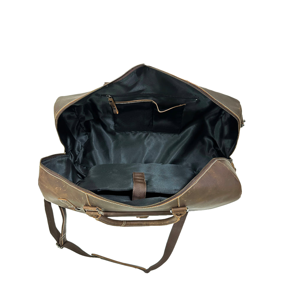 Open brown leather duffel bag on a white background