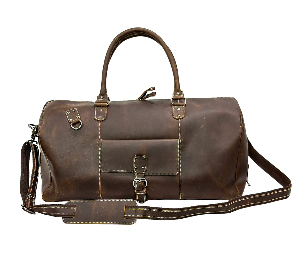 Brown leather duffel bag with straps on a white background