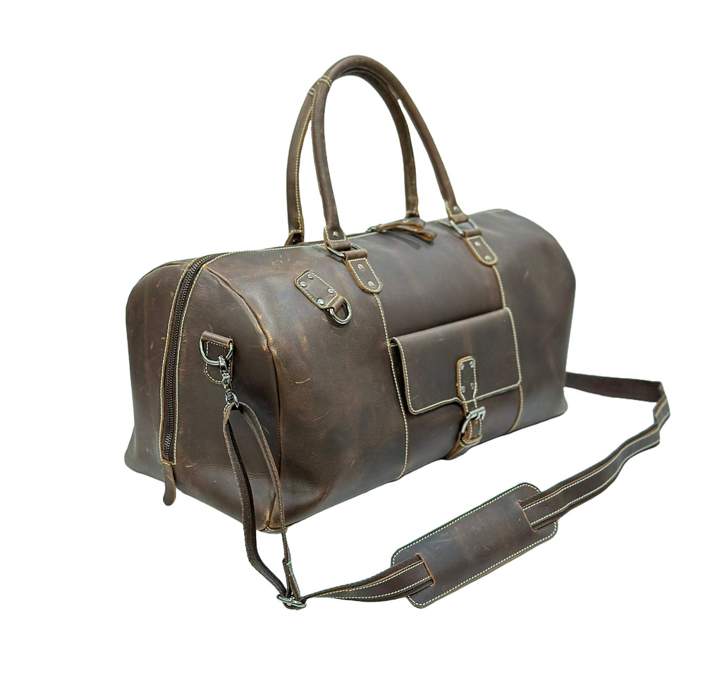 Brown leather duffel bag with straps on a white background